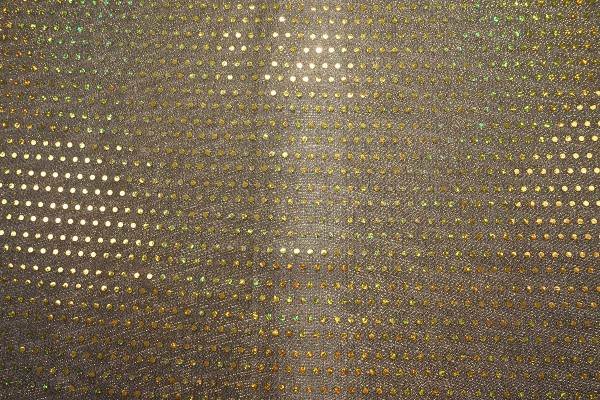 Tkanina dekoracyjna w złote kropki