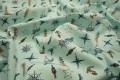 Bawełna perkal - morski motyw na miętowym tle