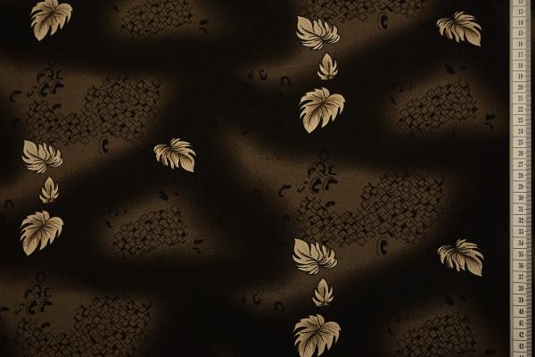 Tkanina sukienkowa - beżowe listki na brązowym tle