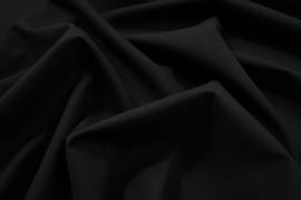 Tkanina wełniana z domieszką poliestru w kolorze czarnym z lekko widoczną kratką