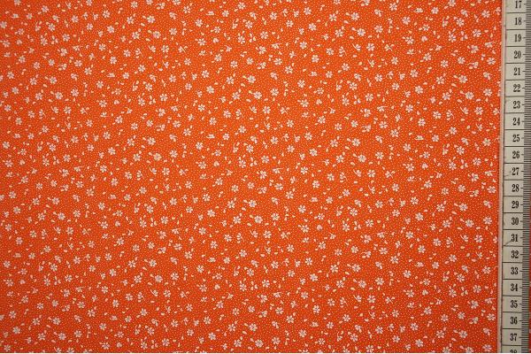 Bawełna drukowana w kolorze pomarańczowym w białe kwiatki
