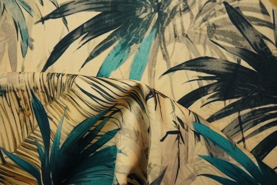 Tkanina zasłonowa w tropikalne liście palmowe turkusowo-czarne na beżowym tle