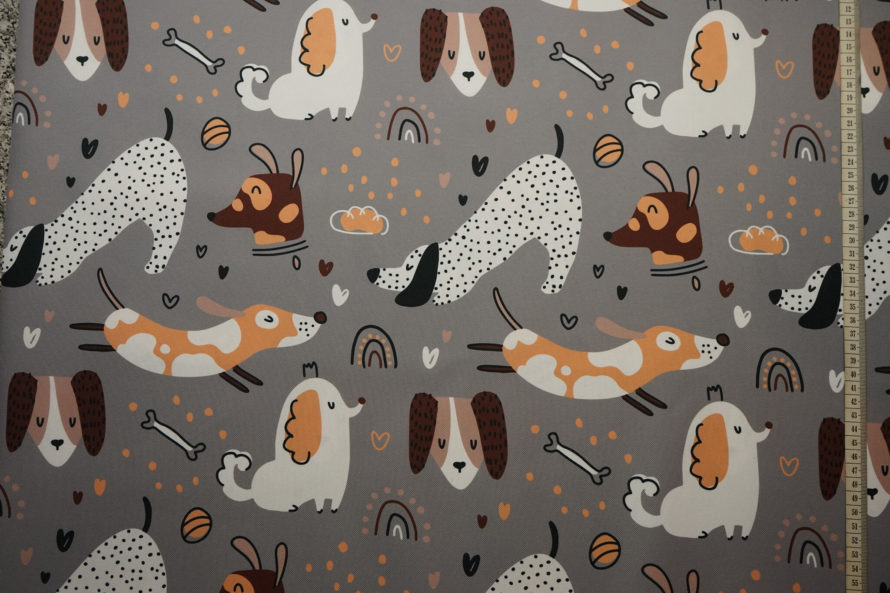 tkanina wodoodporna z pieskami na szarym tle